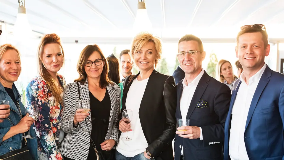 Smiling guests at the Executive Summit cocktail reception