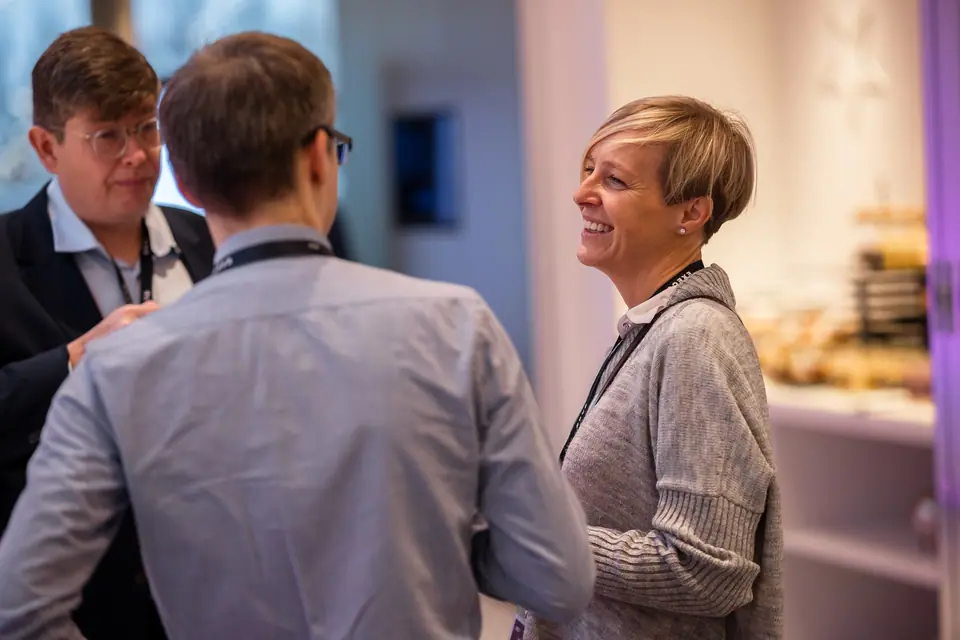 Laughter during a conversation in the EXS 2024 lobby